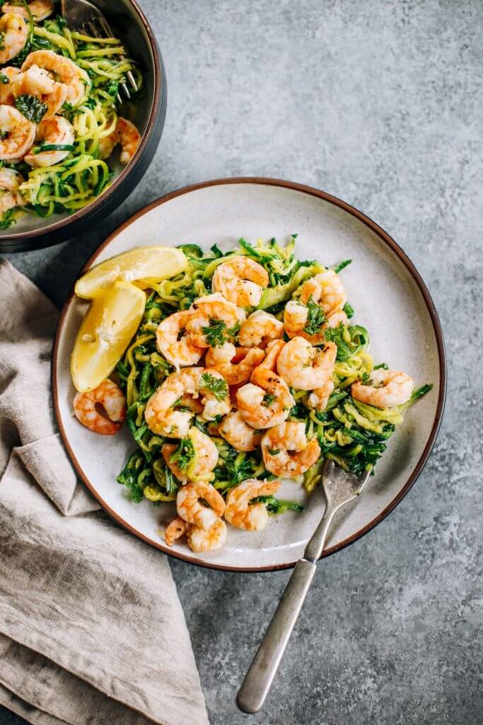 Whole30 zucchini noodles with lemon garlic shrimp. An easy and delicious weeknight dinner. Who’s ready for this healthy low calorie and filling paleo dinner? #paleo #whole30 #healthydinner