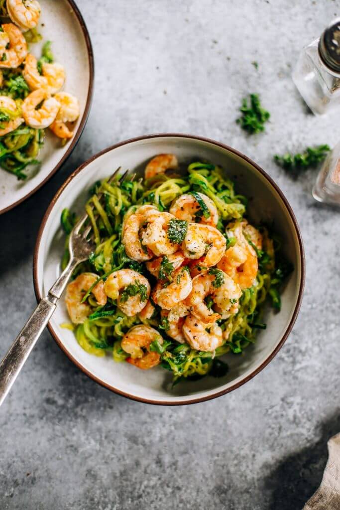 Whole30 zucchini noodles with lemon garlic shrimp. An easy and delicious weeknight dinner. Who’s ready for this healthy low calorie and filling paleo dinner? #paleo #whole30 #healthydinner