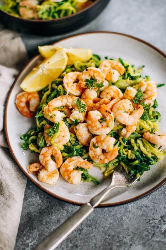 Whole30 zucchini noodles with lemon garlic shrimp. An easy and delicious weeknight dinner. Who’s ready for this healthy low calorie and filling paleo dinner? #paleo #whole30 #healthydinner