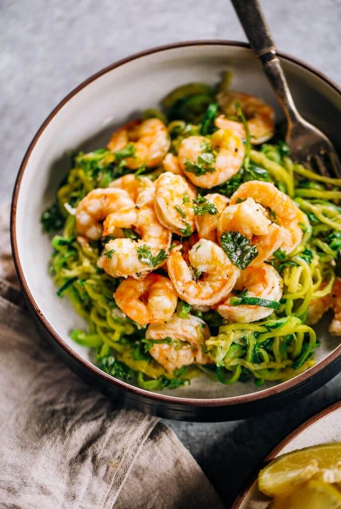 Whole30 zucchini noodles with lemon garlic shrimp. An easy and delicious weeknight dinner. Who’s ready for this healthy low calorie and filling paleo dinner? #paleo #whole30 #healthydinner