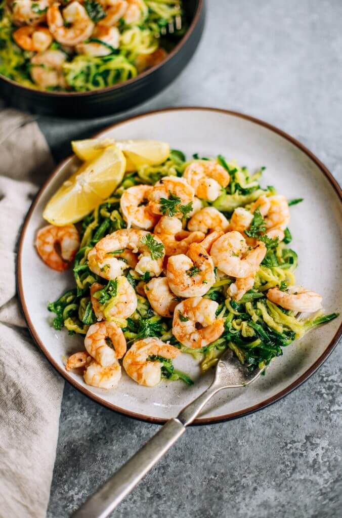 Whole30 zucchini noodles with lemon garlic shrimp. An easy and delicious weeknight dinner. Who’s ready for this healthy low calorie and filling paleo dinner? #paleo #whole30 #healthydinner