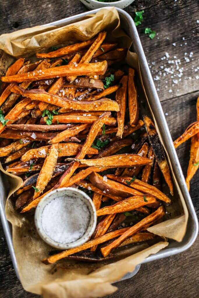 How to make crispy sweet potato fries in 30 minutes! Paleo and whole30 sweet potato fries are a healthy side dish or snack. Make these easy sweet potato fries to serve along a salad or soup. Delicious! Crispy! Easy! #paleo #whole30 #vegan