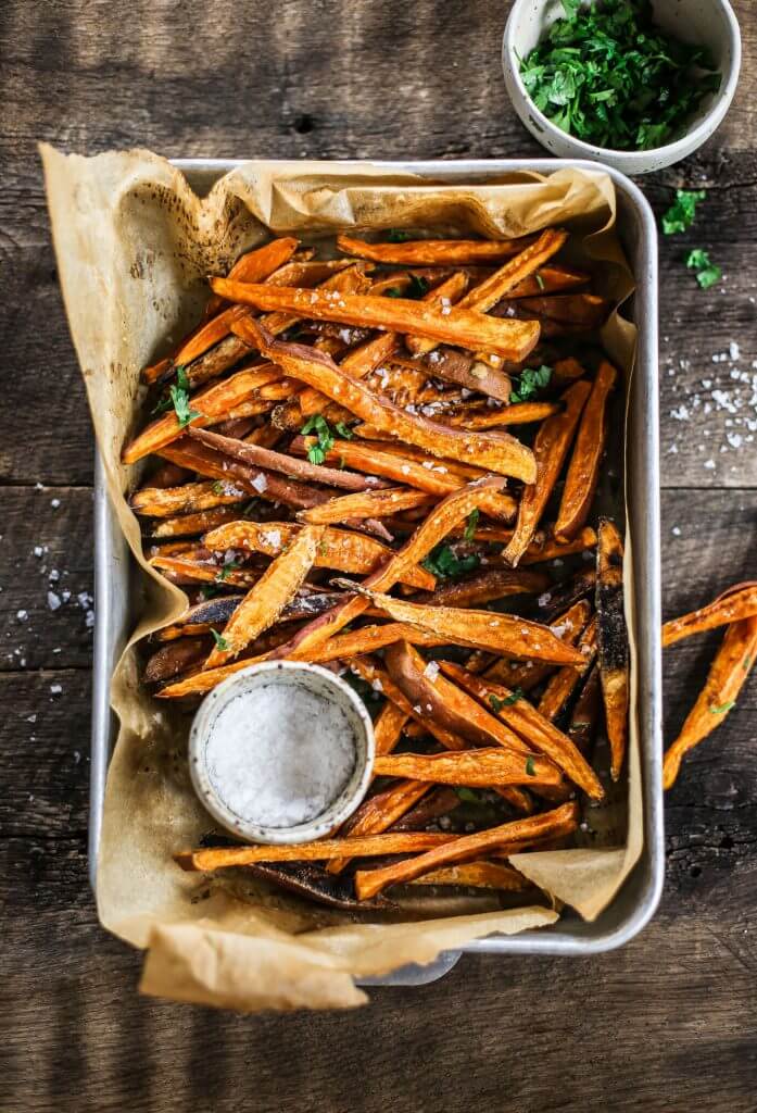 How to make crispy sweet potato fries in 30 minutes! Paleo and whole30 sweet potato fries are a healthy side dish or snack. Make these easy sweet potato fries to serve along a salad or soup. Delicious! Crispy! Easy! #paleo #whole30 #vegan