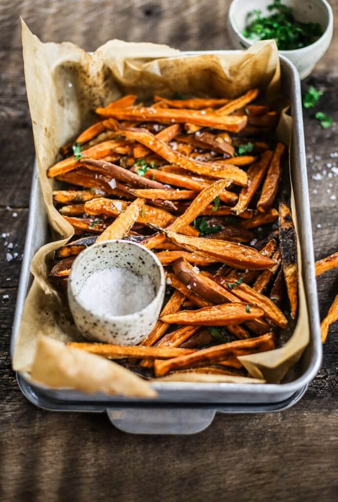 How to make crispy sweet potato fries in 30 minutes! Paleo and whole30 sweet potato fries are a healthy side dish or snack. Make these easy sweet potato fries to serve along a salad or soup. Delicious! Crispy! Easy! #paleo #whole30 #vegan