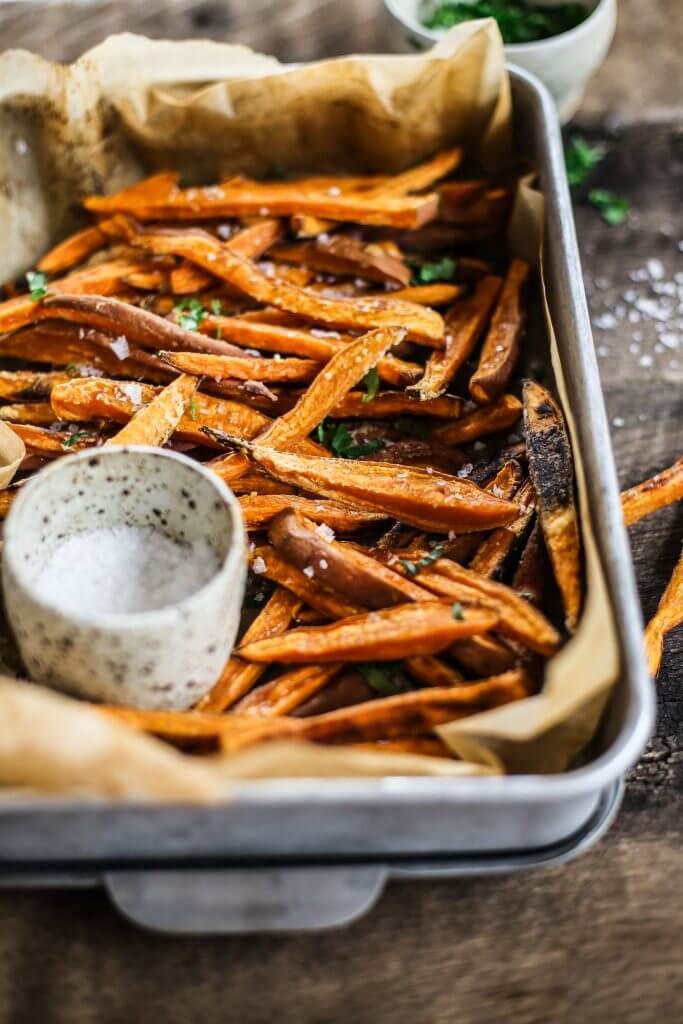 How to make crispy sweet potato fries in 30 minutes! Paleo and whole30 sweet potato fries are a healthy side dish or snack. Make these easy sweet potato fries to serve along a salad or soup. Delicious! Crispy! Easy! #paleo #whole30 #vegan