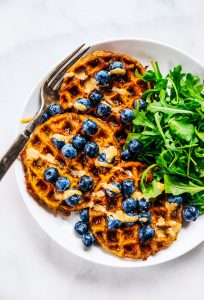 Sweet potato waffles made with two ingredients and ready in just five minutes! These sweet potato waffles are better than Eggos and can be made ahead and frozen for quick meal prep. Best paleo waffles for healthy eaters. Easy gluten free waffles for everyone!