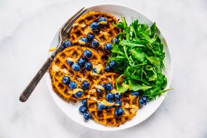 Sweet potato waffles made with two ingredients and ready in just five minutes! These sweet potato waffles are better than Eggos and can be made ahead and frozen for quick meal prep. Best paleo waffles for healthy eaters. Easy gluten free waffles for everyone!