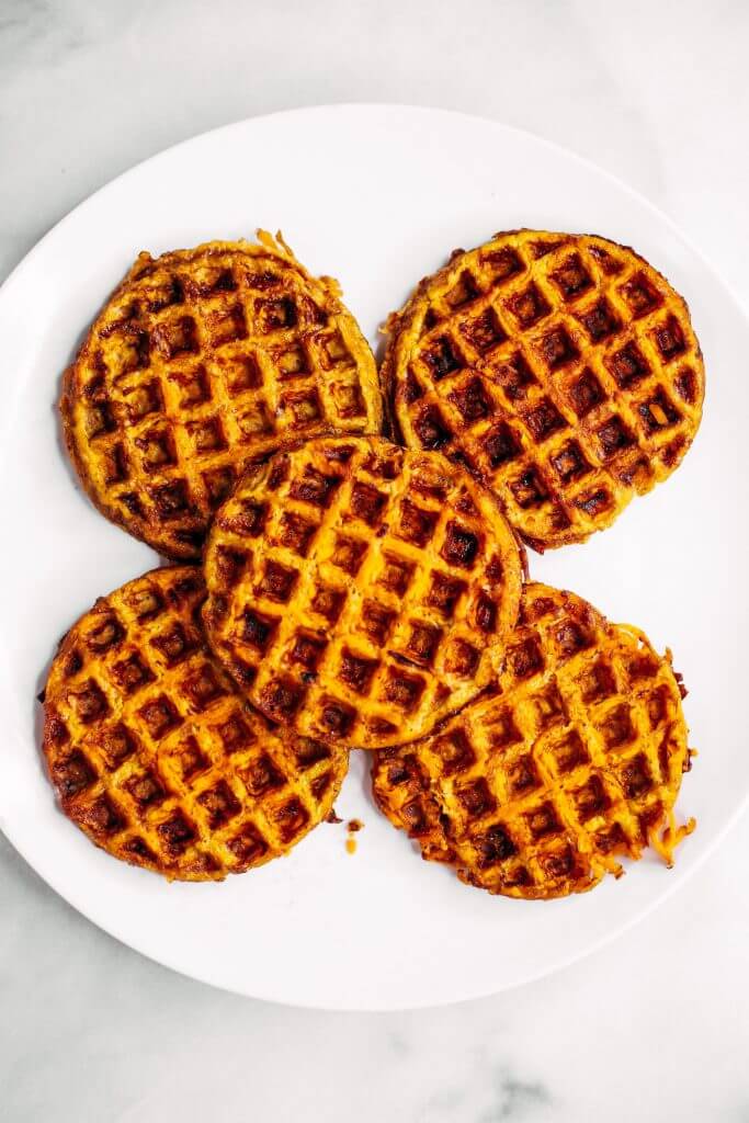 Sweet potato waffles made with two ingredients and ready in just five minutes! These sweet potato waffles are better than Eggos and can be made ahead and frozen for quick meal prep. Best paleo waffles for healthy eaters. Easy gluten free waffles for everyone!