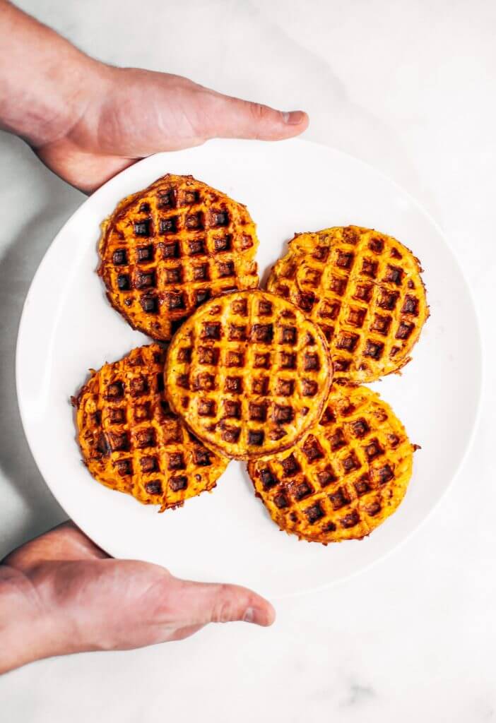 Sweet potato waffles made with two ingredients and ready in just five minutes! These sweet potato waffles are better than Eggos and can be made ahead and frozen for quick meal prep. Best paleo waffles for healthy eaters. Easy gluten free waffles for everyone!