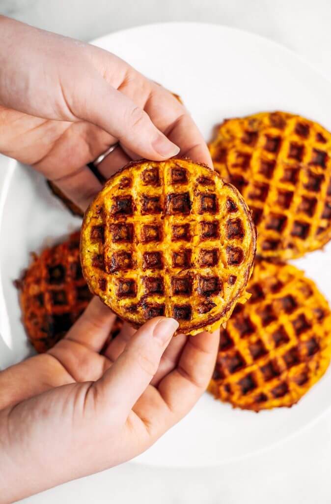 Sweet potato waffles made with two ingredients and ready in just five minutes! These sweet potato waffles are better than Eggos and can be made ahead and frozen for quick meal prep. Best paleo waffles for healthy eaters. Easy gluten free waffles for everyone!