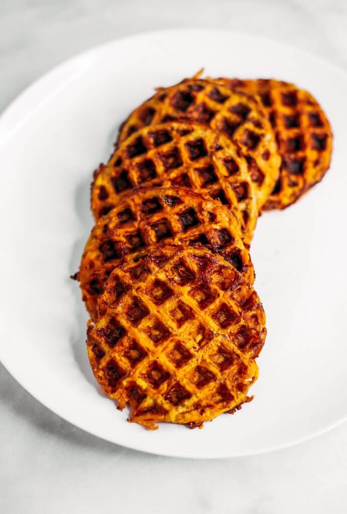 Sweet potato waffles made with two ingredients and ready in just five minutes! These sweet potato waffles are better than Eggos and can be made ahead and frozen for quick meal prep. Best paleo waffles for healthy eaters. Easy gluten free waffles for everyone!