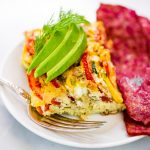 Easy whole30 egg and zucchini breakfast bake with tomatoes, yellow squash, herbs, and zucchini. This paleo breakfast is perfect for meal prep at the beginning of the week and paired with one of my homemade sweet potato tortillas! #paleo #whole30 #bacon