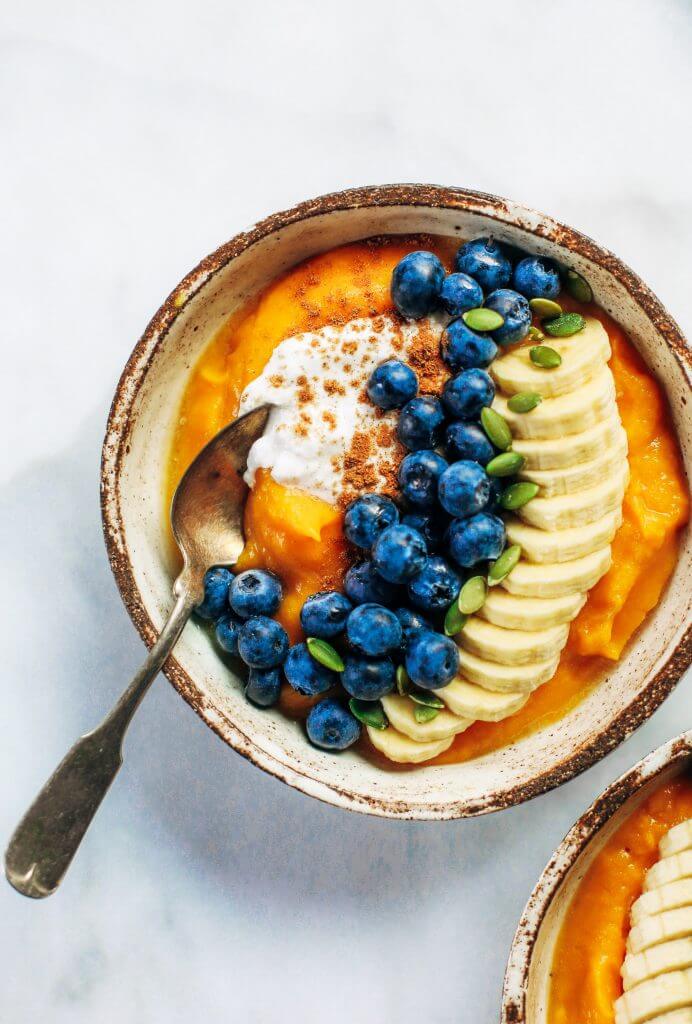 Paleo whole30 breakfast bowl made with butternut squash. Topped off with blueberries, bananas, and pumpkin seeds. This healthy breakfast is easy for on-the-go lifestyles and busy families. Plus, it tastes amazing and will leave you wanting more! #paleo #recipes #cooking #whole30