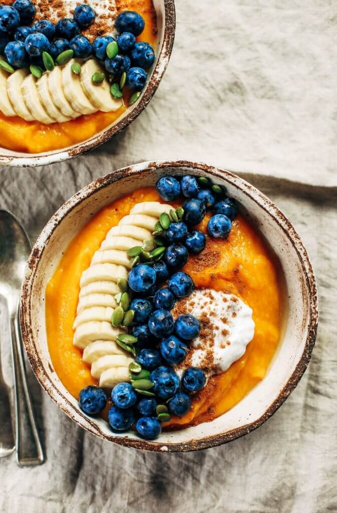Paleo whole30 breakfast bowl made with butternut squash. Topped off with blueberries, bananas, and pumpkin seeds. This healthy breakfast is easy for on-the-go lifestyles and busy families. Plus, it tastes amazing and will leave you wanting more! #paleo #recipes #cooking #whole30