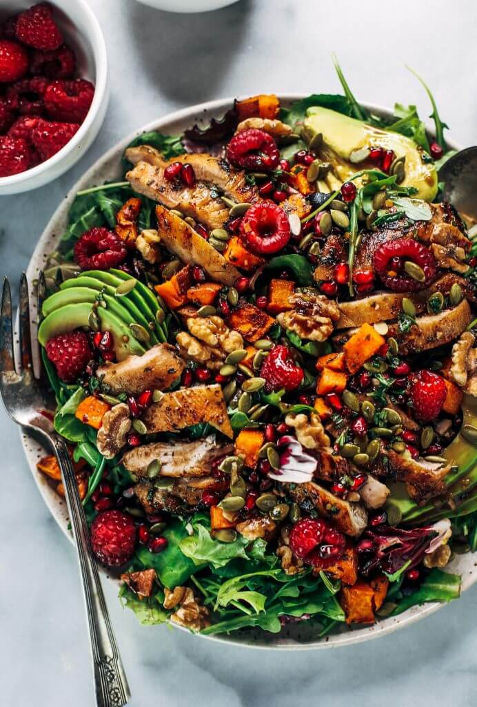 Whole30 harvest chicken salad with roasted rosemary sweet potatoes, avocado, nuts and berries, and homemade balsamic dressing. My favorite salad I eat on repeat! A healthy family dinner for paleo meal prep. #paleo #salad #whole30 #mealprep