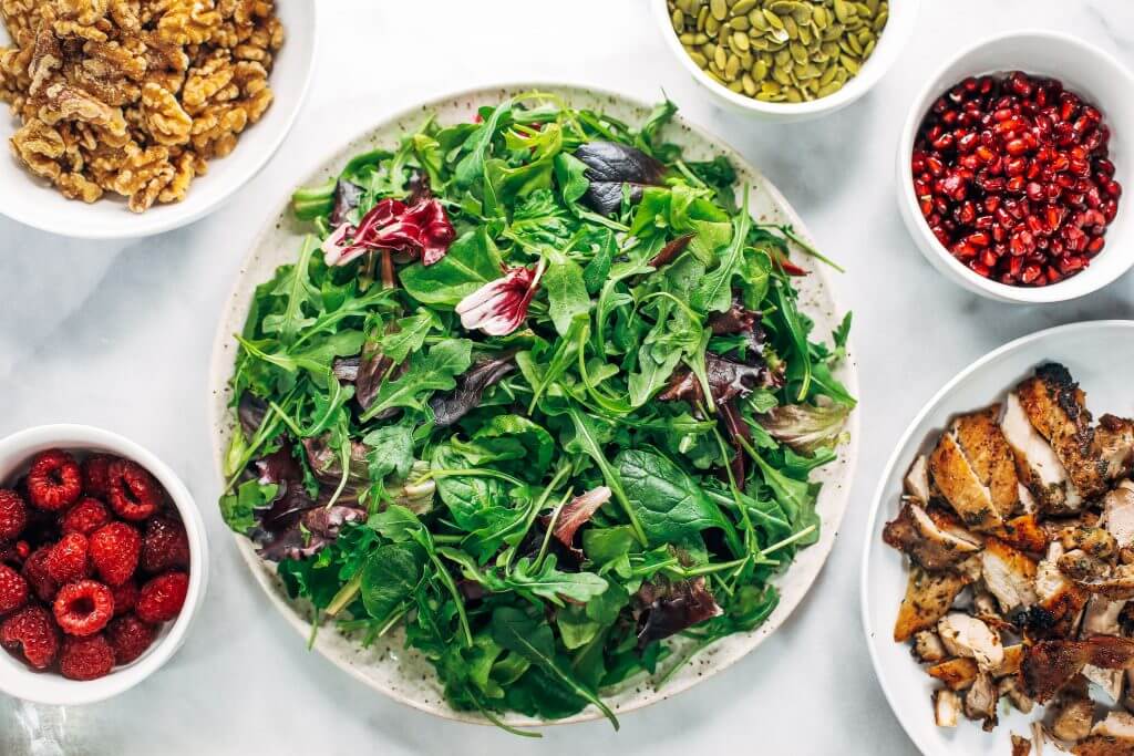 Whole30 harvest chicken salad with roasted rosemary sweet potatoes, avocado, nuts and berries, and homemade balsamic dressing. My favorite salad I eat on repeat! A healthy family dinner for paleo meal prep. #paleo #salad #whole30 #mealprep