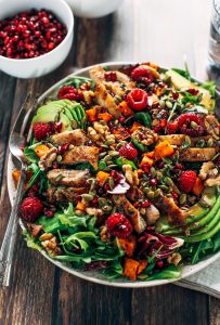 Whole30 harvest chicken salad with roasted rosemary sweet potatoes, avocado, nuts and berries, and homemade balsamic dressing. My favorite salad I eat on repeat! A healthy family dinner for paleo meal prep. #paleo #salad #whole30 #mealprep