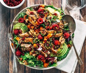 Whole30 harvest chicken salad with roasted rosemary sweet potatoes, avocado, nuts and berries, and homemade balsamic dressing. My favorite salad I eat on repeat! A healthy family dinner for paleo meal prep. #paleo #salad #whole30 #mealprep