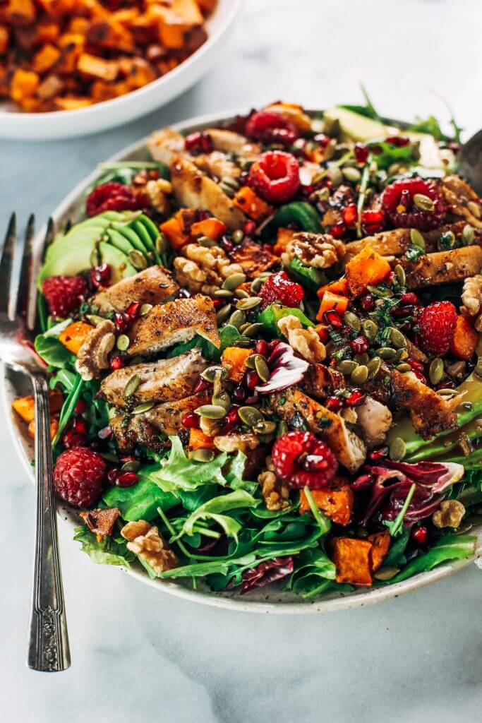 Whole30 harvest chicken salad with roasted rosemary sweet potatoes, avocado, nuts and berries, and homemade balsamic dressing. My favorite salad I eat on repeat! A healthy family dinner for paleo meal prep. #paleo #salad #whole30 #mealprep