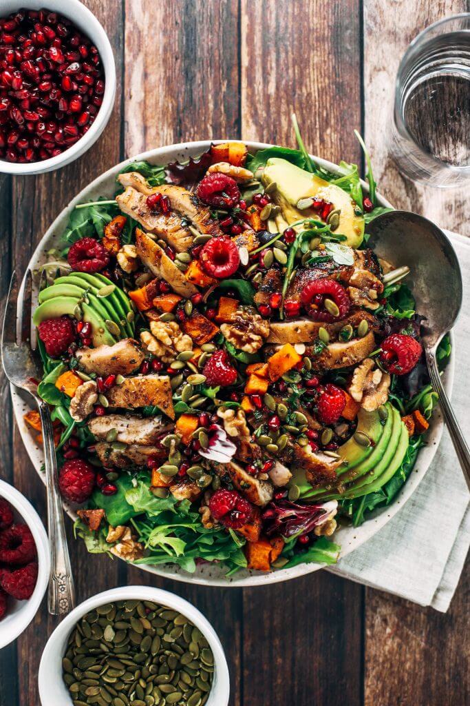 Whole30 harvest chicken salad with roasted rosemary sweet potatoes, avocado, nuts and berries, and homemade balsamic dressing. My favorite salad I eat on repeat! A healthy family dinner for paleo meal prep. #paleo #salad #whole30 #mealprep