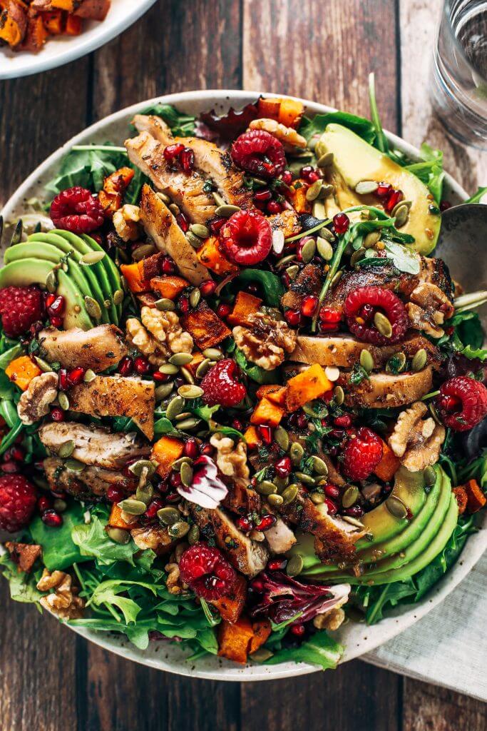 Whole30 harvest chicken salad with roasted rosemary sweet potatoes, avocado, nuts and berries, and homemade balsamic dressing. My favorite salad I eat on repeat! A healthy family dinner for paleo meal prep. #paleo #salad #whole30 #mealprep