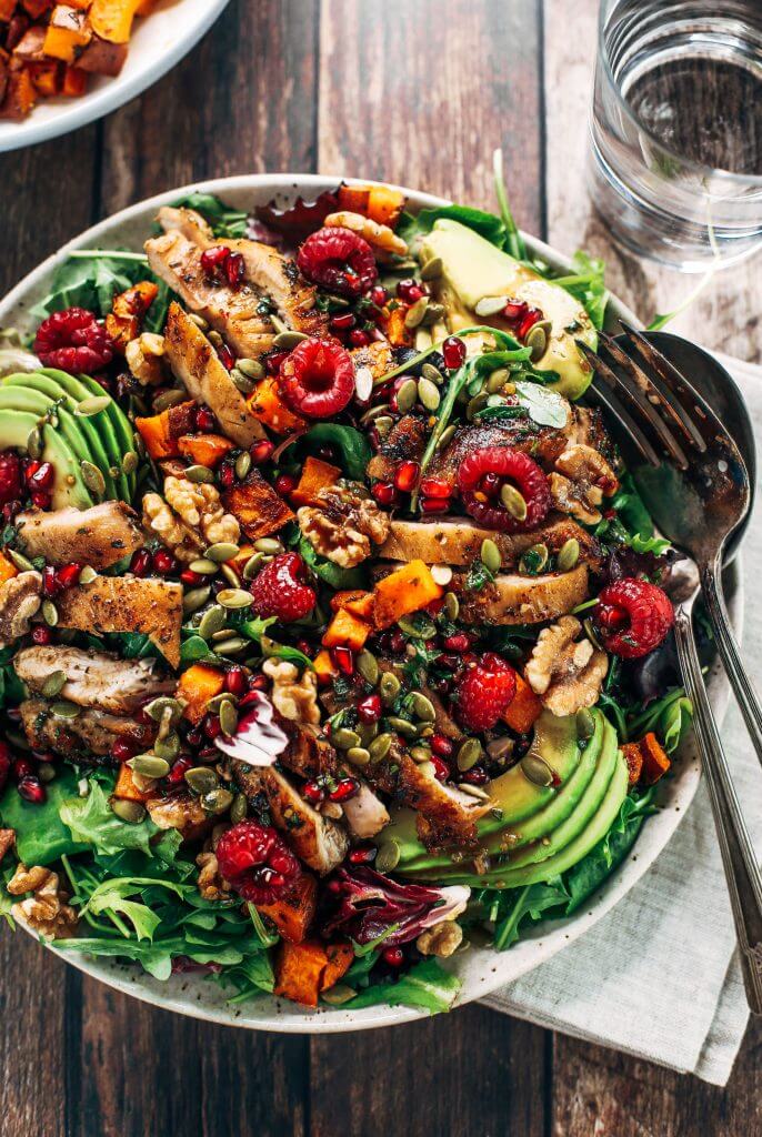 Whole30 harvest chicken salad with roasted rosemary sweet potatoes, avocado, nuts and berries, and homemade balsamic dressing. My favorite salad I eat on repeat! A healthy family dinner for paleo meal prep. #paleo #salad #whole30 #mealprep