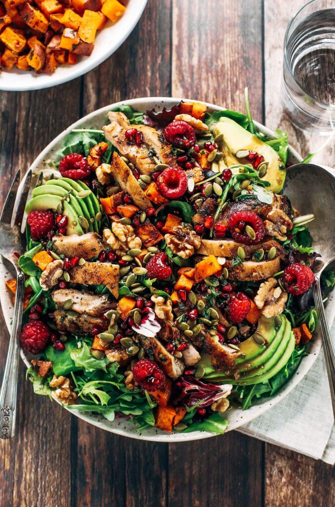 Whole30 harvest chicken salad with roasted rosemary sweet potatoes, avocado, nuts and berries, and homemade balsamic dressing. My favorite salad I eat on repeat! A healthy family dinner for paleo meal prep. #paleo #salad #whole30 #mealprep