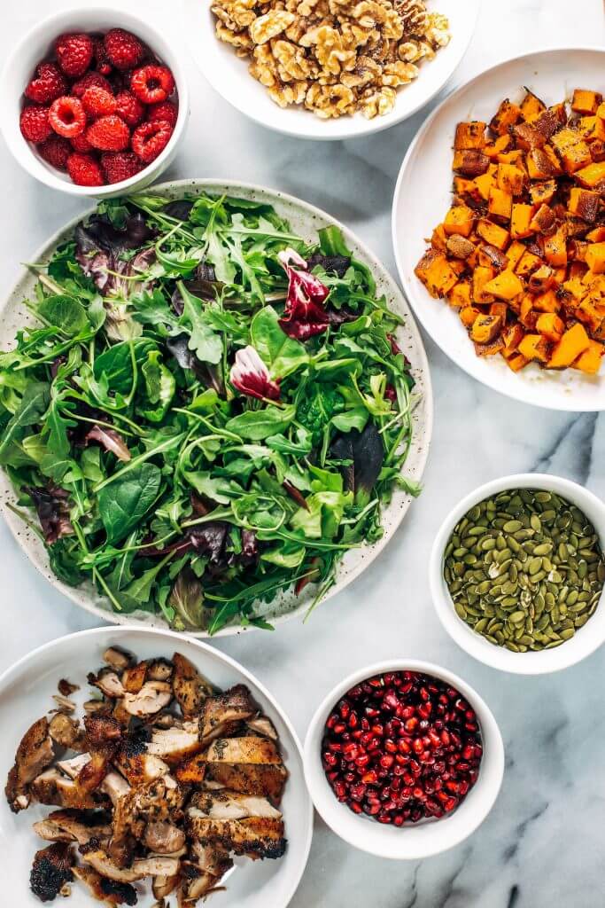 Whole30 harvest chicken salad with roasted rosemary sweet potatoes, avocado, nuts and berries, and homemade balsamic dressing. My favorite salad I eat on repeat! A healthy family dinner for paleo meal prep. #paleo #salad #whole30 #mealprep