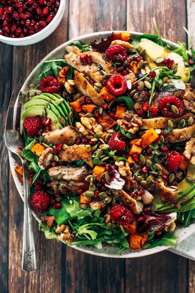 Whole30 harvest chicken salad with roasted rosemary sweet potatoes, avocado, nuts and berries, and homemade balsamic dressing. My favorite salad I eat on repeat! A healthy family dinner for paleo meal prep. #paleo #salad #whole30 #mealprep