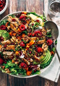 Whole30 harvest chicken salad with roasted rosemary sweet potatoes, avocado, nuts and berries, and homemade balsamic dressing. My favorite salad I eat on repeat! A healthy family dinner for paleo meal prep. #paleo #salad #whole30 #mealprep