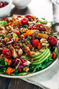 Whole30 harvest chicken salad with roasted rosemary sweet potatoes, avocado, nuts and berries, and homemade balsamic dressing. My favorite salad I eat on repeat! A healthy family dinner for paleo meal prep. #paleo #salad #whole30 #mealprep