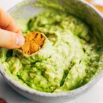 Avocado lime dip ready in two minutes! Vegan avocado guacamole dip, perfect dip for veggie sticks, crackers, and chips. Easy paleo and whole30 side dish. This fresh and tasty avocado dip is a life-changing easy meal prep hack- add it to any dish to upgrade your meal. #avocado #paleo #whole30 #vegan #recipes