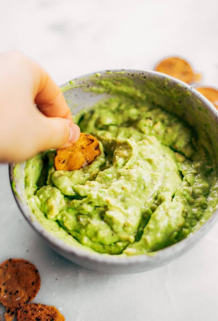 Avocado lime dip ready in two minutes! Vegan avocado guacamole dip, perfect dip for veggie sticks, crackers, and chips. Easy paleo and whole30 side dish. This fresh and tasty avocado dip is a life-changing easy meal prep hack- add it to any dish to upgrade your meal. #avocado #paleo #whole30 #vegan #recipes