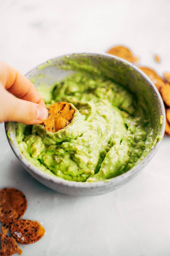 Avocado lime dip ready in two minutes! Vegan avocado guacamole dip, perfect dip for veggie sticks, crackers, and chips. Easy paleo and whole30 side dish. This fresh and tasty avocado dip is a life-changing easy meal prep hack- add it to any dish to upgrade your meal. #avocado #paleo #whole30 #vegan #recipes