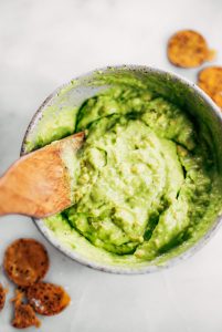 Avocado lime dip ready in two minutes! Vegan avocado guacamole dip, perfect dip for veggie sticks, crackers, and chips. Easy paleo and whole30 side dish. This fresh and tasty avocado dip is a life-changing easy meal prep hack- add it to any dish to upgrade your meal. #avocado #paleo #whole30 #vegan #recipes