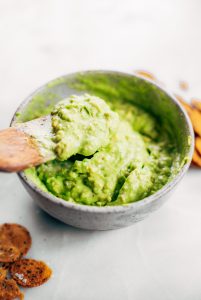 Avocado lime dip ready in two minutes! Vegan avocado guacamole dip, perfect dip for veggie sticks, crackers, and chips. Easy paleo and whole30 side dish. This fresh and tasty avocado dip is a life-changing easy meal prep hack- add it to any dish to upgrade your meal. #avocado #paleo #whole30 #vegan #recipes