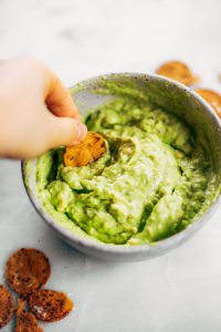 Avocado lime dip ready in two minutes! Vegan avocado guacamole dip, perfect dip for veggie sticks, crackers, and chips. Easy paleo and whole30 side dish. This fresh and tasty avocado dip is a life-changing easy meal prep hack- add it to any dish to upgrade your meal. #avocado #paleo #whole30 #vegan #recipes