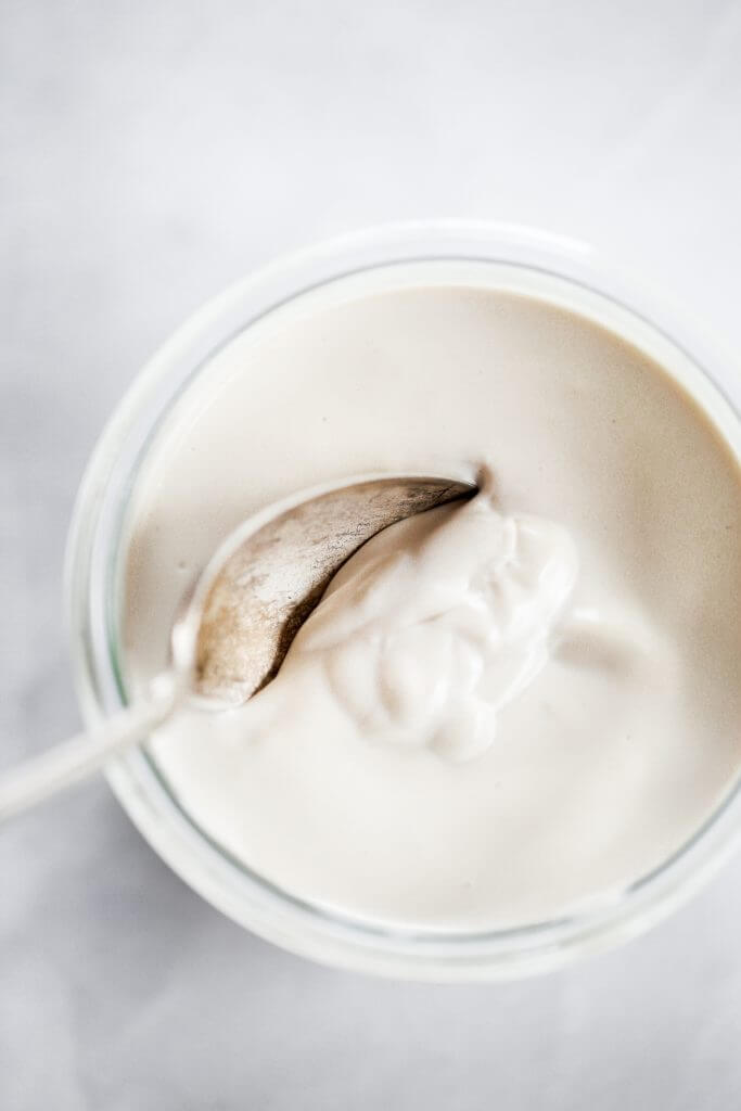 2 minute dairy free yogurt recipe. Healthy cashew yogurt ready in just minutes! This creamy paleo yogurt is perfect served for breakfast with fruit. Made with just three ingredients! #paleo #yogurt #healthybreakfast #recipes #cooking #mealprep