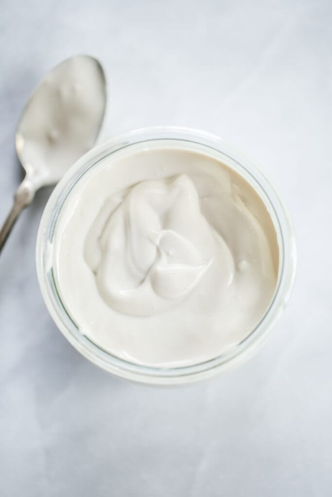 2 minute dairy free yogurt recipe. Healthy cashew yogurt ready in just minutes! This creamy paleo yogurt is perfect served for breakfast with fruit. Made with just three ingredients! #paleo #yogurt #healthybreakfast #recipes #cooking #mealprep