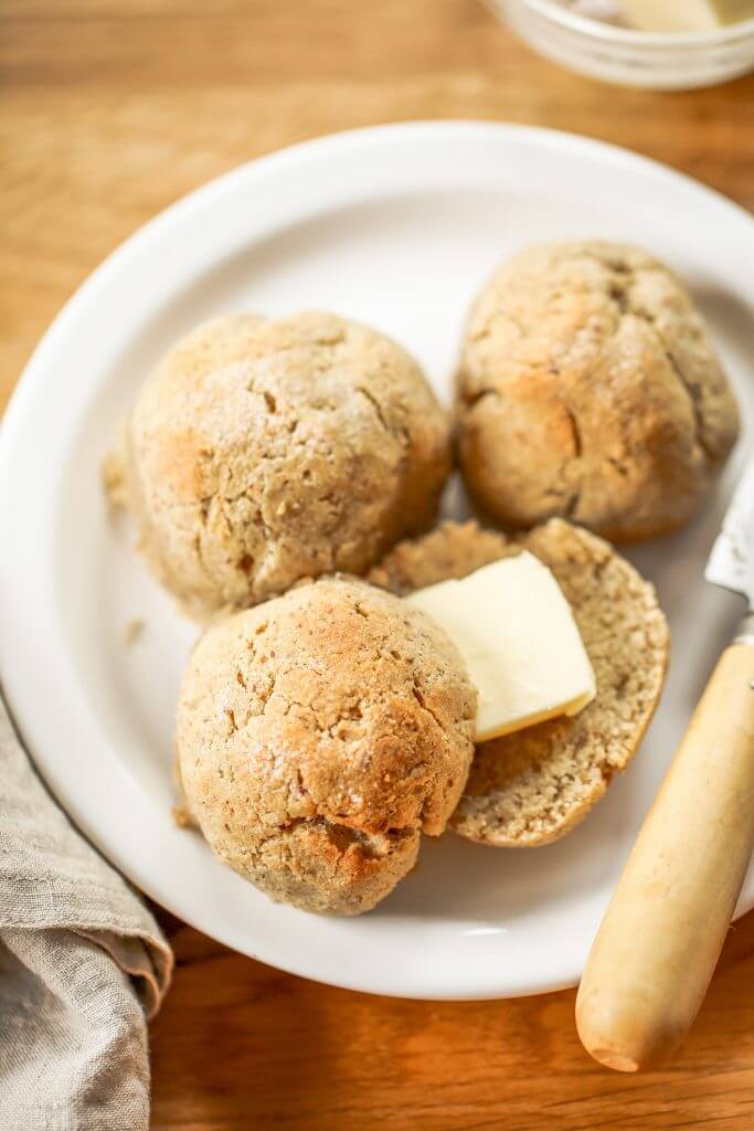 Homemade dinner rolls made with almond flour. These healthier paleo bread rolls are so easy to make and have no yeast! It's an easy gluten free bread recipe that the whole family will love. Perfect for serving with soup for dinner or with eggs for breakfast. #paleo #bread #baking #recipes #cooking