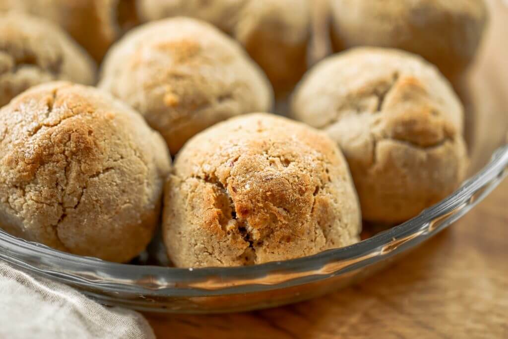 Homemade dinner rolls made with almond flour. These healthier paleo bread rolls are so easy to make and have no yeast! It's an easy gluten free bread recipe that the whole family will love. Perfect for serving with soup for dinner or with eggs for breakfast. #paleo #bread #baking #recipes #cooking