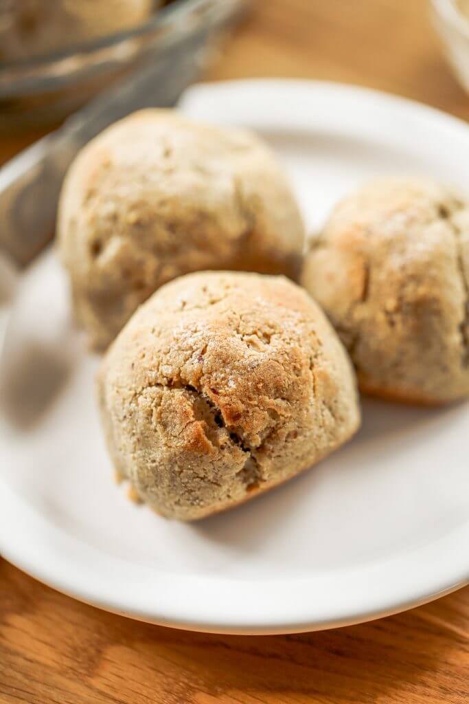 Homemade dinner rolls made with almond flour. These healthier paleo bread rolls are so easy to make and have no yeast! It's an easy gluten free bread recipe that the whole family will love. Perfect for serving with soup for dinner or with eggs for breakfast. #paleo #bread #baking #recipes #cooking
