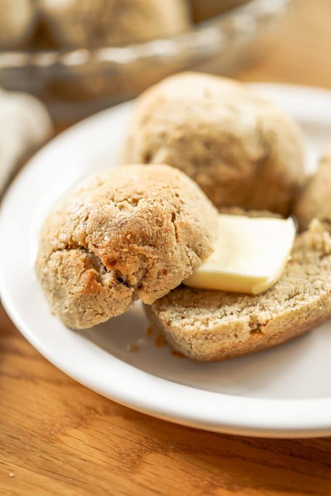 Homemade dinner rolls made with almond flour. These healthier paleo bread rolls are so easy to make and have no yeast! It's an easy gluten free bread recipe that the whole family will love. Perfect for serving with soup for dinner or with eggs for breakfast. #paleo #bread #baking #recipes #cooking