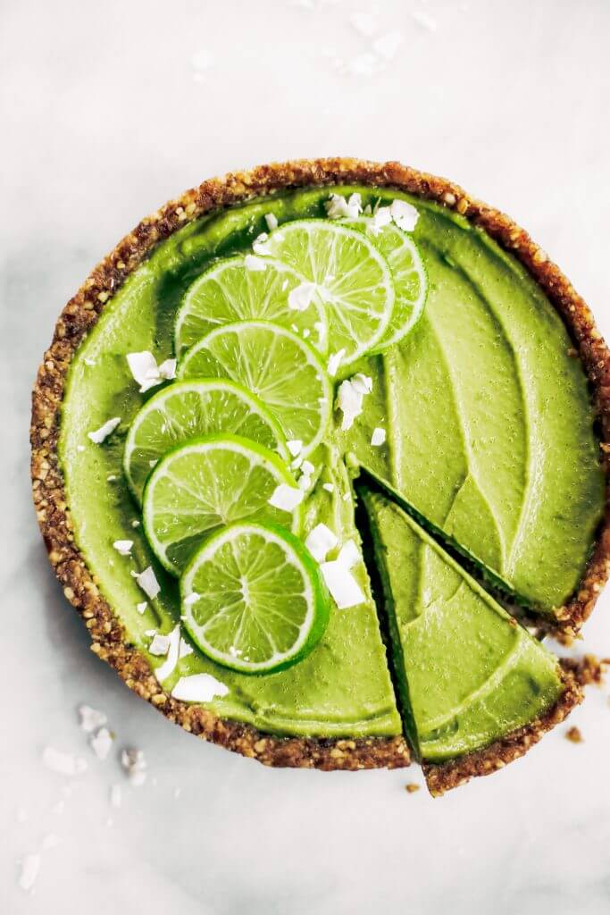 Delicious key lime pie! This vegan key lime pie recipe is made with avocados and will slay the dessert table- even the non-vegans in my life love this recipe! Healthy paleo and raw key lime pie recipe. #vegan #paleo #avocados #recipes #baking #pie