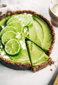 Delicious key lime pie! This vegan key lime pie recipe is made with avocados and will slay the dessert table- even the non-vegans in my life love this recipe! Healthy paleo and raw key lime pie recipe. #vegan #paleo #avocados #recipes #baking #pie