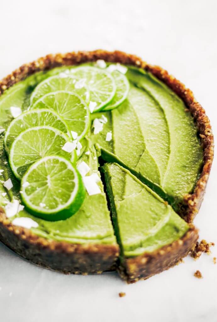 Delicious key lime pie! This vegan key lime pie recipe is made with avocados and will slay the dessert table- even the non-vegans in my life love this recipe! Healthy paleo and raw key lime pie recipe. #vegan #paleo #avocados #recipes #baking #pie