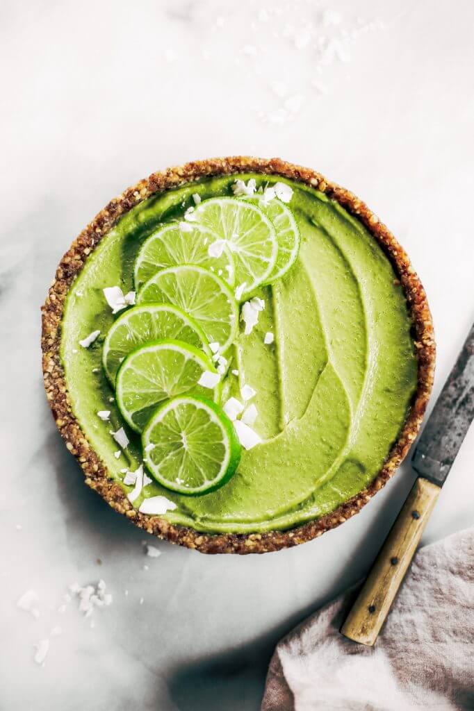Delicious key lime pie! This vegan key lime pie recipe is made with avocados and will slay the dessert table- even the non-vegans in my life love this recipe! Healthy paleo and raw key lime pie recipe. #vegan #paleo #avocados #recipes #baking #pie