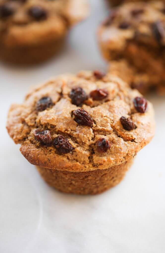 Light and healthy carrot muffins made with almond flour. Oil-free paleo muffin recipe, packed with protein and lots of yummy orange zest flavor and spices! This easy gluten-free muffin recipe is an easy family breakfast served with a side of bacon... or not. #paleo #baking #recipes #glutenfree