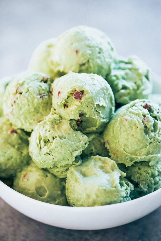 Mint chocolate chip ice-cream made with avocados! Dairy free and delicious ice-cream recipe that you DON'T even need an ice-cream maker to make this recipe! Love this paleo and vegan recipe for mint chocolate chip ice-cream. #paleo #ice-cream #recipes #cooking #vegan #desserts