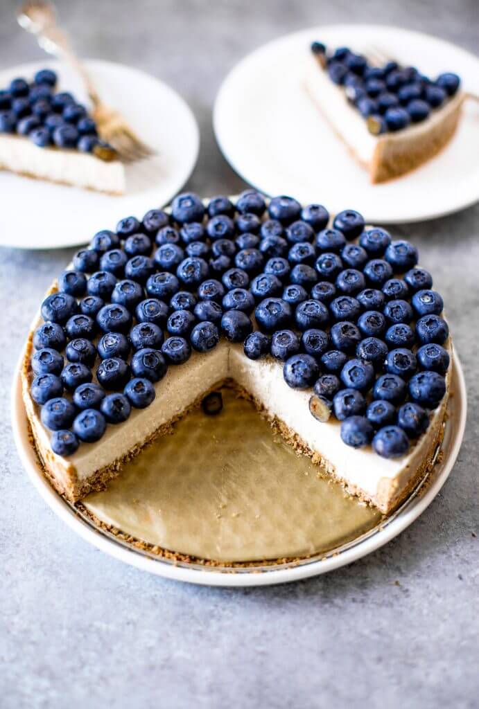 Blueberry creamy pie made with dairy-free coconut cream filling and homemade paleo coconut flour crust. Fresh and easy summer dessert topped with plenty of fresh blueberries! An easy paleo blueberry cream pie recipe. #pie #baking #recipes #paleo #cooking #dessert